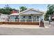 Charming cottage with front porch, plenty of seating, and inviting curb appeal at 6001 - Z-49 S Kings Hwy., Myrtle Beach, SC 29575