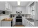 Well-organized kitchen features white cabinetry and stainless steel appliances at 6001 - Z-49 S Kings Hwy., Myrtle Beach, SC 29575