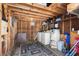 Rustic laundry room with wooden beams, a washer/dryer, and storage shelves at 6001 - Z-49 S Kings Hwy., Myrtle Beach, SC 29575