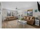 Cozy living room with two sofas, area rug, ceiling fan and lots of natural light at 6001 - Z-49 S Kings Hwy., Myrtle Beach, SC 29575