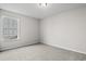 Bright bedroom featuring a single window, plush carpet, and neutral wall paint at 604 Woodside Dr., Conway, SC 29526