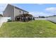 Spacious backyard with a dining pergola, hot tub under gazebo, and large lawn at 651 Choctaw Dr., Conway, SC 29526