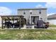 Spacious backyard featuring an entertainment area with a pergola, hot tub gazebo, seating and lush green grass at 651 Choctaw Dr., Conway, SC 29526