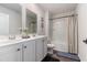 Well-lit bathroom featuring double sinks with modern fixtures, a decorative mirror and shower and bath combination at 651 Choctaw Dr., Conway, SC 29526