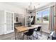 Bright dining room with a farmhouse style table and industrial light fixture at 651 Choctaw Dr., Conway, SC 29526