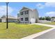Charming two-story home with gray siding, black shutters and manicured front yard with garage at 651 Choctaw Dr., Conway, SC 29526