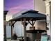 Stylish outdoor gazebo featuring a hot tub, exterior lighting, wood beams, and fence enclosed yard at 651 Choctaw Dr., Conway, SC 29526