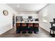 Well-equipped kitchen featuring an island with bar seating, granite countertops, and stainless steel appliances at 651 Choctaw Dr., Conway, SC 29526