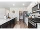 Well-equipped kitchen featuring granite countertops, stainless steel appliances and pantry at 651 Choctaw Dr., Conway, SC 29526