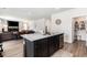 Open kitchen and living area with granite countertops, island and cozy fireplace at 651 Choctaw Dr., Conway, SC 29526