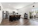 Modern kitchen with white cabinets, stainless steel appliances, granite countertops, and a dark island with seating at 651 Choctaw Dr., Conway, SC 29526
