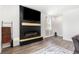 Living room featuring a black accent wall with fireplace and wooden mantle at 651 Choctaw Dr., Conway, SC 29526