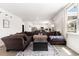 Spacious living room featuring a large sectional sofa, hardwood floors, and large windows at 651 Choctaw Dr., Conway, SC 29526