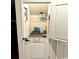 Cozy pet room under the stairs featuring built-in storage and a cute bone-shaped door handle at 651 Choctaw Dr., Conway, SC 29526