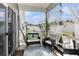 Relaxing porch featuring comfortable seating, a patterned rug, and decorative elements, perfect for outdoor enjoyment at 651 Choctaw Dr., Conway, SC 29526