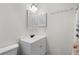 Bathroom featuring an updated white vanity and sink with black faucet and updated toilet at 6576 Pebble Beach Crescent, Myrtle Beach, SC 29588