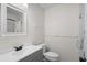 Bathroom with updated vanity, sink, and matte black faucet, plus updated toilet, mirror and hardware at 6576 Pebble Beach Crescent, Myrtle Beach, SC 29588