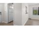 View of the kitchen featuring white appliances and flooring, with neutral walls at 6576 Pebble Beach Crescent, Myrtle Beach, SC 29588