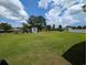 Expansive backyard featuring a shed, playset, and plenty of green space for outdoor activities at 671 American Beech St., Loris, SC 29569