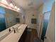 Bright bathroom featuring modern fixtures, a spacious vanity, and a large mirror at 671 American Beech St., Loris, SC 29569