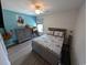 Bright bedroom with a bed, dresser, and a desk, offering a comfortable and functional space at 671 American Beech St., Loris, SC 29569