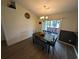 Cozy dining area with wooden table and access to the outdoor patio at 671 American Beech St., Loris, SC 29569