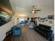 Open concept living room featuring wood floors and views of the dining area and kitchen at 671 American Beech St., Loris, SC 29569