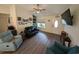 Comfortable living room featuring a ceiling fan and wood floors extending to the entryway at 671 American Beech St., Loris, SC 29569