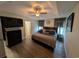Relaxing main bedroom featuring trey ceiling, ceiling fan, and en-suite bathroom at 671 American Beech St., Loris, SC 29569