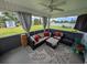 Outdoor patio with a comfortable seating area, ceiling fan, and views of the backyard, perfect for relaxation at 671 American Beech St., Loris, SC 29569
