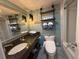 Coastal bathroom featuring a vanity with storage and an alcove shower at 6900 N Ocean Blvd. # 201, Myrtle Beach, SC 29572