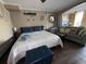 Inviting bedroom featuring a queen bed, sofa, and nautical decor at 6900 N Ocean Blvd. # 201, Myrtle Beach, SC 29572