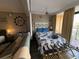 Cozy bedroom with a nautical theme, including a queen-sized bed and seating area at 6900 N Ocean Blvd. # 201, Myrtle Beach, SC 29572