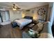 Inviting bedroom featuring a queen bed, sofa, and ocean themed decor at 6900 N Ocean Blvd. # 201, Myrtle Beach, SC 29572