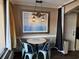 Cozy dining area featuring a table for four, window, and nautical decor at 6900 N Ocean Blvd. # 201, Myrtle Beach, SC 29572