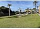 Lawn area featuring hammocks and seating near the community grills at 6900 N Ocean Blvd. # 201, Myrtle Beach, SC 29572