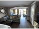 Open-concept living space featuring a sofa, queen bed, and balcony access at 6900 N Ocean Blvd. # 201, Myrtle Beach, SC 29572