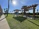Outdoor picnic area with charcoal grills and covered picnic tables at 6900 N Ocean Blvd. # 201, Myrtle Beach, SC 29572