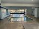 Indoor pool area with a shallow pool and large windows with access to the outdoors at 6900 N Ocean Blvd. # 201, Myrtle Beach, SC 29572