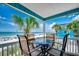 Relax on the balcony with ocean views and a table for outdoor dining at 720 N Waccamaw Dr. # 205, Garden City Beach, SC 29576