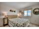 Comfortable bedroom featuring beachy decor, coastal views, and natural light at 720 N Waccamaw Dr. # 205, Garden City Beach, SC 29576