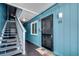 Building hallway with muted blue walls leading to unit #205 with easy access to the stairwell at 720 N Waccamaw Dr. # 205, Garden City Beach, SC 29576