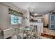 Cozy dining area with a view of the modern kitchen, perfect for Gathering meals and entertaining guests at 720 N Waccamaw Dr. # 205, Garden City Beach, SC 29576