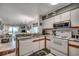 Modern kitchen with essential appliances seamlessly integrated into the open-concept living space at 720 N Waccamaw Dr. # 205, Garden City Beach, SC 29576
