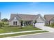 Charming single-story home with well-manicured lawn and a two-car garage, creating a welcoming curb appeal at 7374 Sarteano Dr., Myrtle Beach, SC 29572