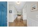 Inviting hallway with hardwood floors and view of the living room, creating a warm and open ambiance at 7374 Sarteano Dr., Myrtle Beach, SC 29572