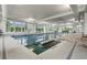 Bright indoor pool with lap lanes, large windows, and access steps for easy entry at 7374 Sarteano Dr., Myrtle Beach, SC 29572