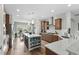 Modern kitchen featuring a large island, stainless steel appliances, and wooden cabinetry at 7374 Sarteano Dr., Myrtle Beach, SC 29572