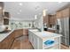 Spacious kitchen featuring a large island, stainless steel appliances, and views to the outside at 7374 Sarteano Dr., Myrtle Beach, SC 29572