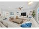 Open concept living room featuring recessed lighting, hardwood floors, decor shelves and a sectional sofa at 7374 Sarteano Dr., Myrtle Beach, SC 29572